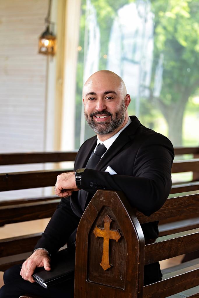 Jeremy Lane, ordained minister, sitting in a church